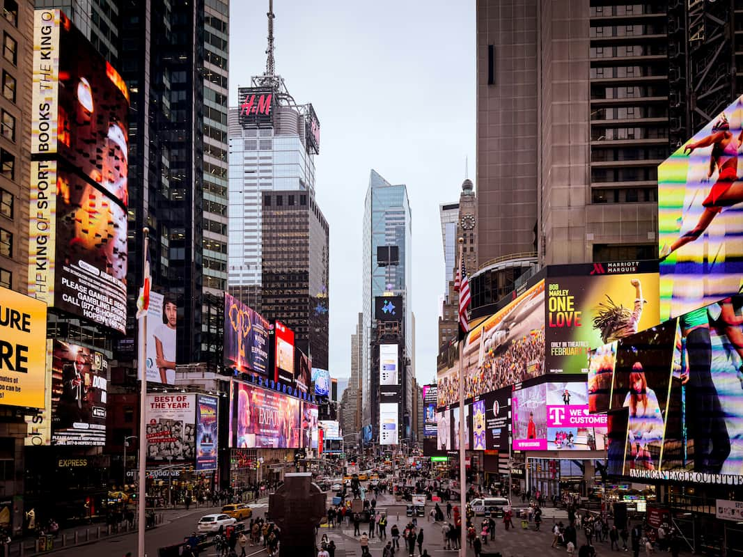 7 Times Square Tower is an all-glass modern skyscraper at the heart of Times Square